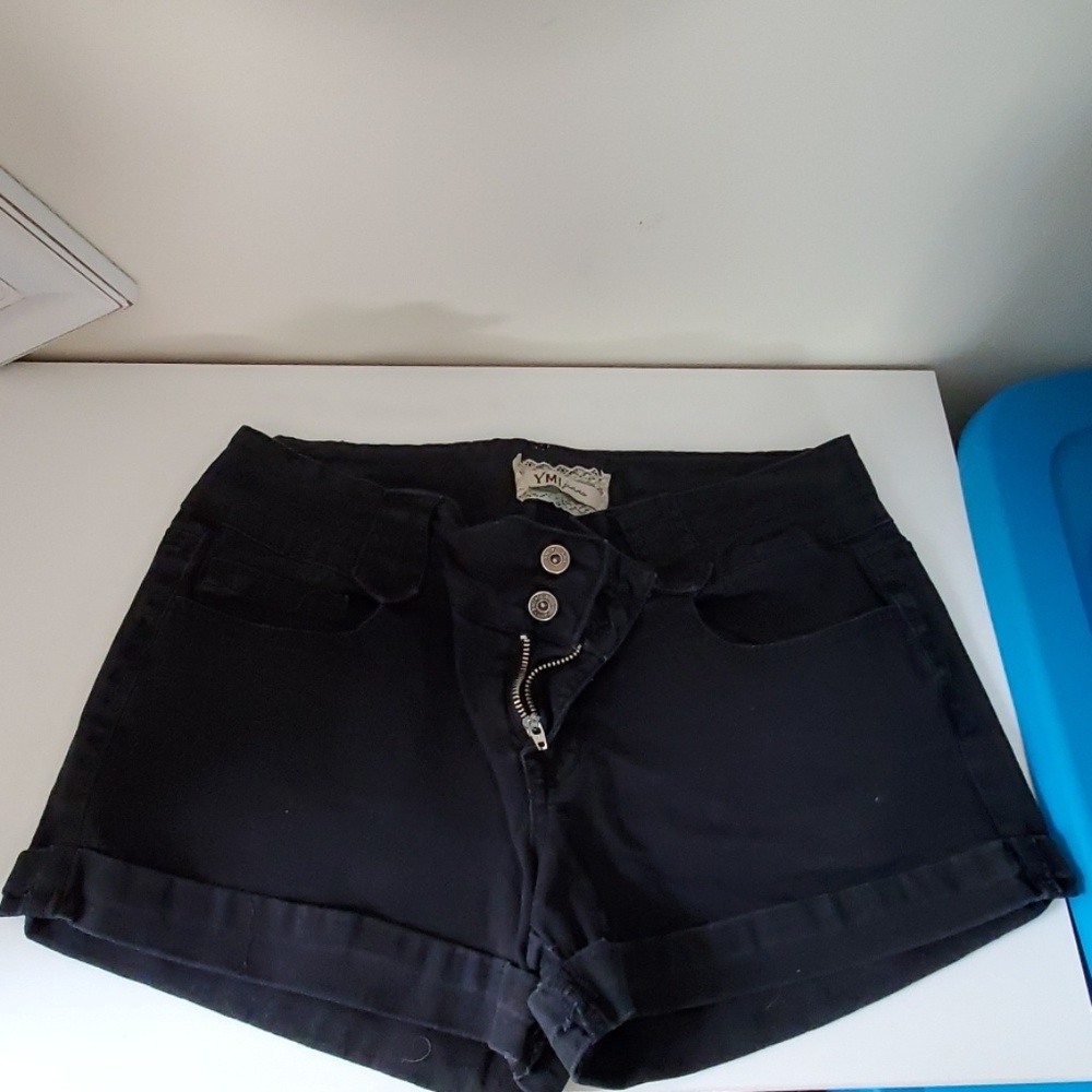 Black shorts with stitched roll on legs
